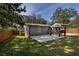 Spacious backyard with green grass, patio and a gazebo set up with an outdoor dining table and chairs at 2189 Gordon Se Cir, Smyrna, GA 30080