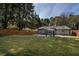 Expansive backyard featuring lush green grass, a gazebo, and a privacy fence for serene outdoor living at 2189 Gordon Se Cir, Smyrna, GA 30080