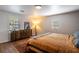 Well-lit bedroom with hardwood floors, a plush bed, and stylish furnishings, offering a cozy retreat at 2189 Gordon Se Cir, Smyrna, GA 30080