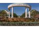 Smyrna Market Village entrance featuring a decorative archway and beautiful landscaping, welcoming residents and visitors alike at 2189 Gordon Se Cir, Smyrna, GA 30080