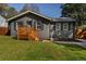 Charming single-story home with a painted brick facade, new deck and well-manicured lawn and landscape at 2189 Gordon Se Cir, Smyrna, GA 30080