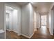 Hallway featuring hardwood floors, neutral paint and doors to various rooms at 2189 Gordon Se Cir, Smyrna, GA 30080