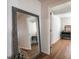Hallway with hardwood floors featuring an ornate mirror and view into the next room at 2189 Gordon Se Cir, Smyrna, GA 30080