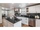 Well-lit kitchen boasting stainless steel appliances, black countertops, and white cabinetry at 2189 Gordon Se Cir, Smyrna, GA 30080