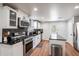 Modern kitchen featuring stainless steel appliances, dark countertops, and ample cabinet space at 2189 Gordon Se Cir, Smyrna, GA 30080