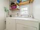 Functional laundry room with washer, dryer, and shelving offering a convenient space for household chores at 2189 Gordon Se Cir, Smyrna, GA 30080