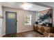 Inviting living room with stylish front door, hardwood floors, and modern décor at 2189 Gordon Se Cir, Smyrna, GA 30080