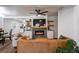 Open-concept living room featuring a modern fireplace, hardwood floors, and stylish decor at 2189 Gordon Se Cir, Smyrna, GA 30080