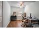 Office space with natural light, hardwood floors and a stylish desk setup, perfect for remote work at 2189 Gordon Se Cir, Smyrna, GA 30080