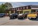 Exterior view of a popular restaurant with ample parking and outdoor seating with umbrellas at 2189 Gordon Se Cir, Smyrna, GA 30080