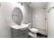 Modern bathroom featuring a vanity, mirror, tiled walk-in shower and grey color scheme at 1027 Garibaldi Sw St, Atlanta, GA 30310