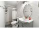 Modern bathroom featuring new vanity, lighting, and herringbone tile shower at 1027 Garibaldi Sw St, Atlanta, GA 30310