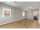 Bright bedroom features hardwood floors, neutral walls and trim, and a ceiling fan at 1027 Garibaldi Sw St, Atlanta, GA 30310