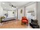Bright bedroom with hardwood floors, ceiling fan, and comfortable furniture at 1027 Garibaldi Sw St, Atlanta, GA 30310