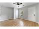 Spacious bedroom with two closets, a window, hardwood floors and neutral walls at 1027 Garibaldi Sw St, Atlanta, GA 30310
