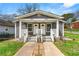 Charming duplex featuring dual entrances and a well-maintained front yard at 1027 Garibaldi Sw St, Atlanta, GA 30310