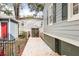 Backyard with a concrete path leading to a detached garage and basement entrance at 1257 Lyle Pl, Atlanta, GA 30318