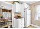 Bright and airy dining area featuring white cabinets, refrigerator, and a table with four chairs at 1257 Lyle Pl, Atlanta, GA 30318