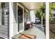 Inviting covered front porch featuring cozy seating, plants, and a decorative wreath on the front door at 1257 Lyle Pl, Atlanta, GA 30318