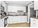 Well-maintained kitchen featuring white cabinets, countertops, and stainless steel appliances for cooking at 1257 Lyle Pl, Atlanta, GA 30318
