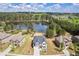Stunning aerial view of a two-story home with lake access and mature landscaping at 1861 Poplar Falls Ave, Lithonia, GA 30058