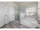 Bathroom with walk-in shower and soaking tub at 1861 Poplar Falls Ave, Lithonia, GA 30058