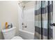 Shower and toilet combo with white and blue color theme at 1861 Poplar Falls Ave, Lithonia, GA 30058