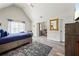 Vaulted ceiling bedroom featuring a sleeping area and dedicated office space with great natural light at 1861 Poplar Falls Ave, Lithonia, GA 30058