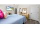 Bright, tidy bedroom featuring wood-look floors, tv, and nice decor at 1861 Poplar Falls Ave, Lithonia, GA 30058