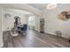 Open-concept dining room featuring hardwood floors and modern decor at 1861 Poplar Falls Ave, Lithonia, GA 30058
