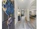 Elegant foyer with hardwood floors, decorative wreath, and views into living and dining spaces at 1861 Poplar Falls Ave, Lithonia, GA 30058