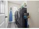 Clean laundry room with new washer and dryer at 1861 Poplar Falls Ave, Lithonia, GA 30058