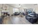 Expansive living room with a fireplace, modern furniture, open layout and view into the kitchen at 1861 Poplar Falls Ave, Lithonia, GA 30058