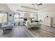 Spacious main bedroom with wood floors, tray ceiling, and ample natural light at 1861 Poplar Falls Ave, Lithonia, GA 30058