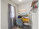 This home office features a modern desk and chair, as well as a decorative shelf with unique decor at 1861 Poplar Falls Ave, Lithonia, GA 30058