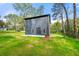 New construction home featuring a spacious backyard with lush greenery and a private patio at 2869 4Th Sw St, Atlanta, GA 30315