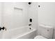 Clean white bathroom with tub-shower combo, and sleek modern fixtures at 2869 4Th Sw St, Atlanta, GA 30315