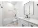 Modern bathroom featuring subway tiles, a shower-tub combo and modern black accents at 2869 4Th Sw St, Atlanta, GA 30315
