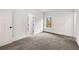 Bedroom with neutral carpet, modern trim, and view of the trees at 2869 4Th Sw St, Atlanta, GA 30315