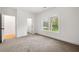 Cozy bedroom with neutral carpet, white trim, and view into a walk-in closet at 2869 4Th Sw St, Atlanta, GA 30315
