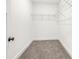 Walk-in closet with ample storage space and neutral carpeting at 2869 4Th Sw St, Atlanta, GA 30315