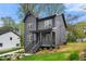 Modern two-story home featuring a covered porch with manicured front yard and landscaping at 2869 4Th Sw St, Atlanta, GA 30315