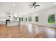 Bright, open living area flows into kitchen, with hardwood floors and views of a lush, green backyard at 2869 4Th Sw St, Atlanta, GA 30315