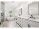 Luxurious main bathroom features dual vanity, modern soaking tub, and glass-enclosed shower at 2869 4Th Sw St, Atlanta, GA 30315