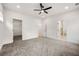 Large main bedroom with ensuite bath and walk-in closet, ceiling fan, and plush carpeting at 2869 4Th Sw St, Atlanta, GA 30315
