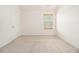 Clean, white bedroom with neutral carpet at 4355 Rainer Dr, Atlanta, GA 30349