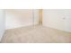 An empty bedroom features neutral walls and carpet, with a door leading to the hallway at 4355 Rainer Dr, Atlanta, GA 30349