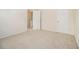 Bedroom with doors to other rooms, carpeted floor and neutral paint at 4355 Rainer Dr, Atlanta, GA 30349