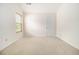 Bright bedroom with a window and vaulted ceilings offers natural light and cozy carpeting at 4355 Rainer Dr, Atlanta, GA 30349