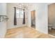 Charming dining area with modern lighting and easy access to a convenient half bath at 4355 Rainer Dr, Atlanta, GA 30349